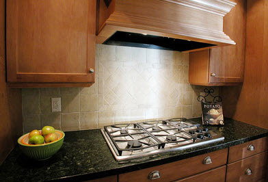 White Kitchen Backsplash with Brown Cabinets and Stove